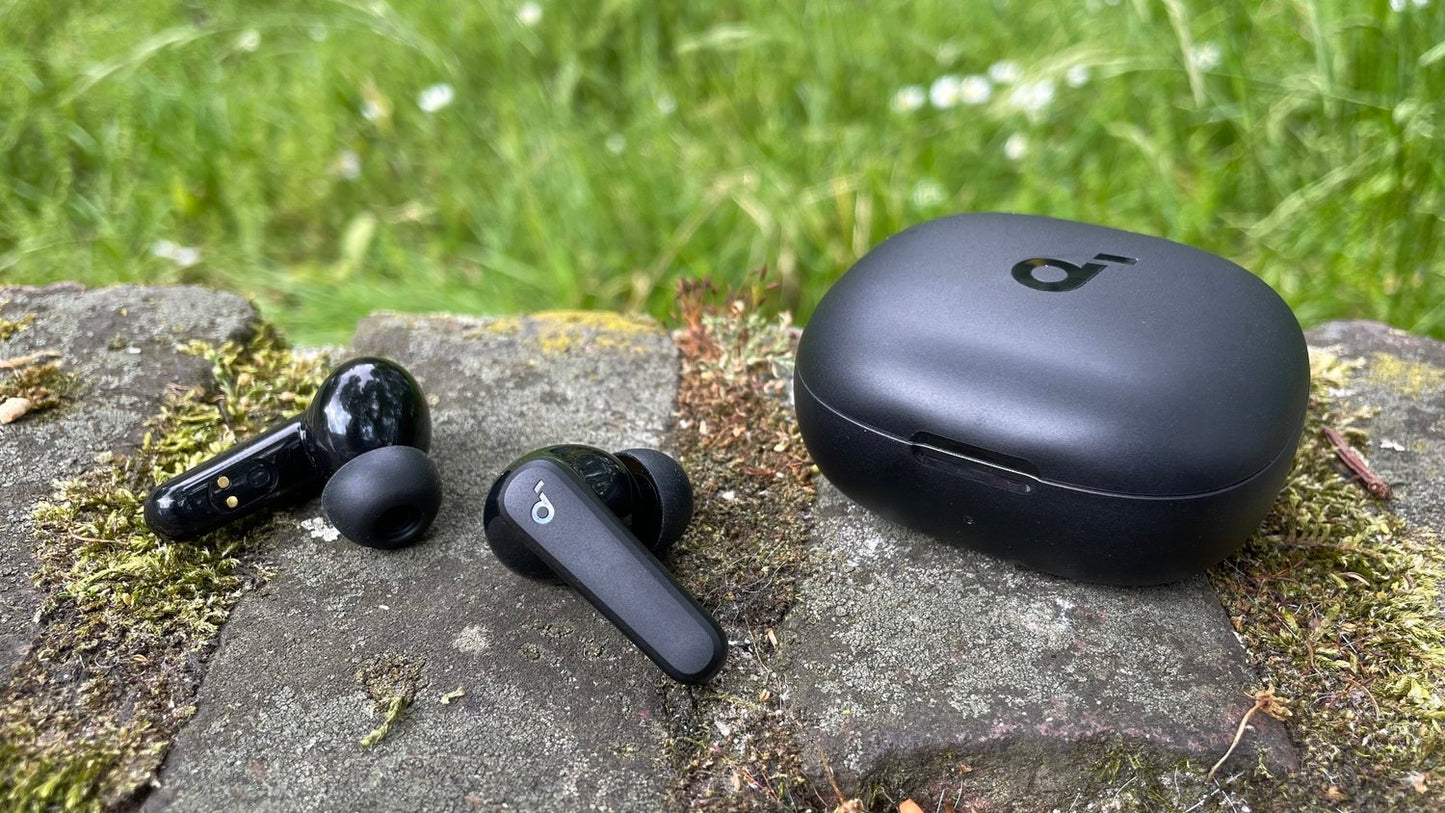 Outdoor shot of closed Soundcore P20i case, showcasing matte black finish and loop strap.