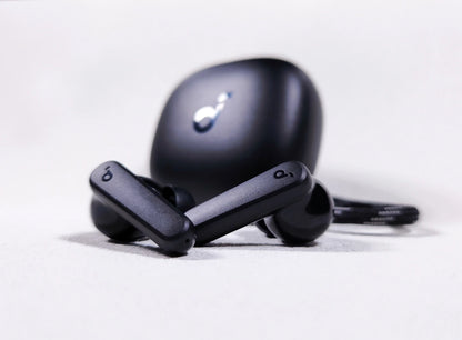 Black Soundcore P20i earbuds displayed upright with case, highlighting stem and earbud design.