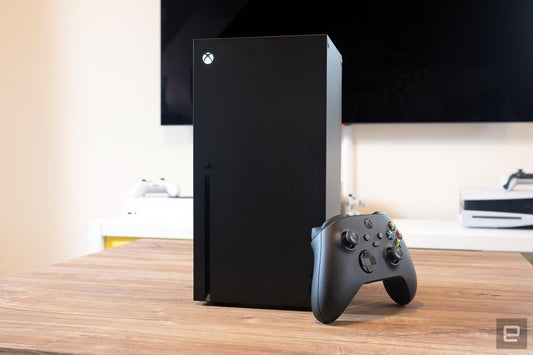 Lifestyle image: Xbox Series X console on a wooden surface with controller, highlighting design and build.